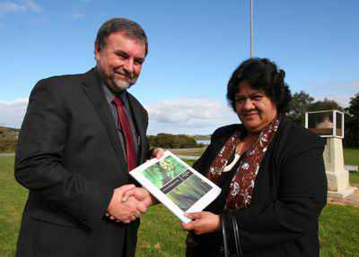 Te Uri O Hau Chairperson Mihi Watene (right) presents Northland Regional Council CEO Malcolm Nicolson with a copy of the hap&#363;'s new environmental management plan which was launched yesterday.